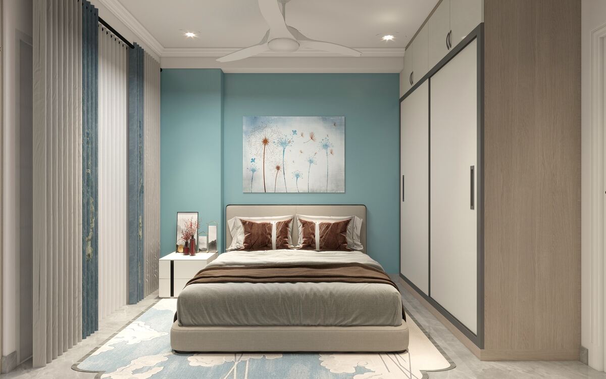Bedroom with a teal feature wall
